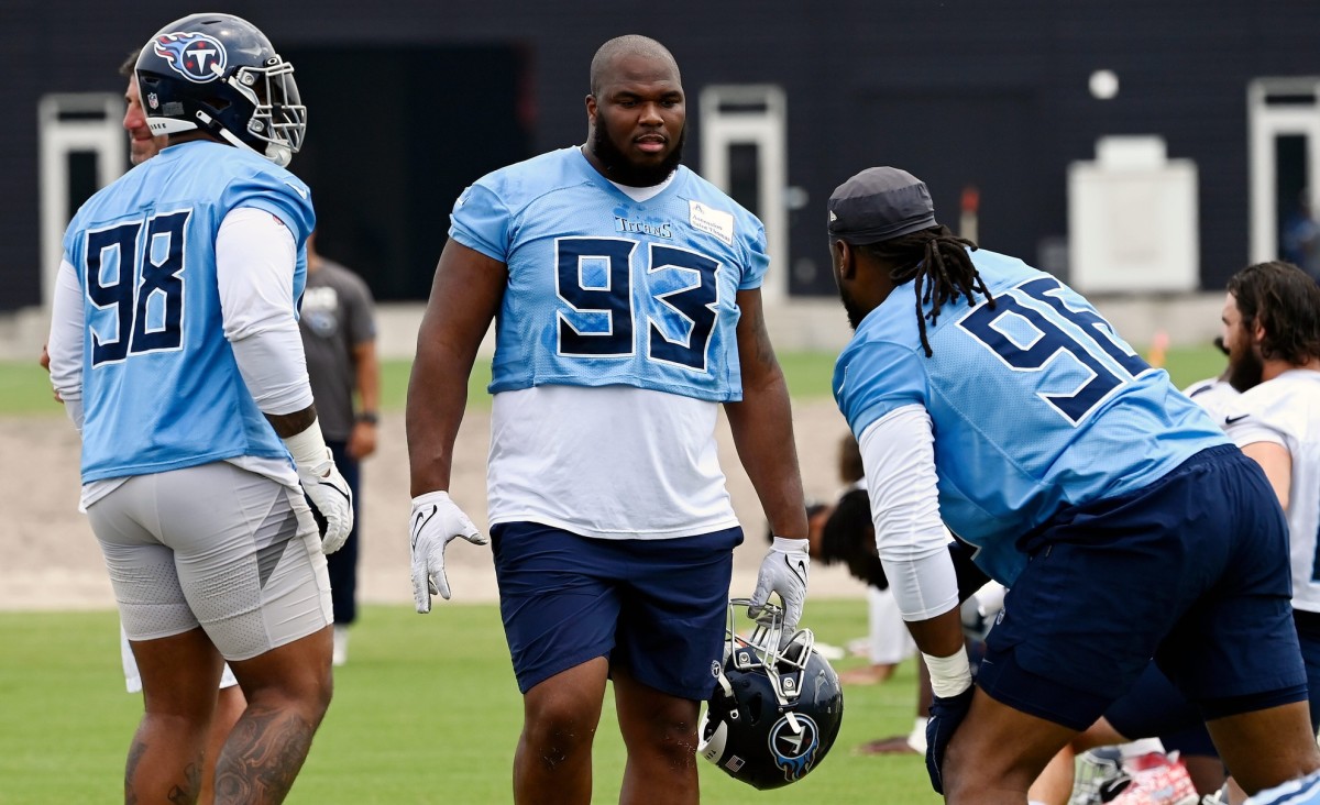 Tennessee Titans defensive tackle Teair Tart (93) talks with Denico Autry (96) during an NFL football minicamp Wednesday, June 7, 2023, in Nashville, Tenn.
